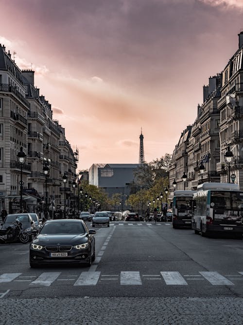 Dramatic Sky over a Downtown Street in Paris with Eiffel Tower in the Background