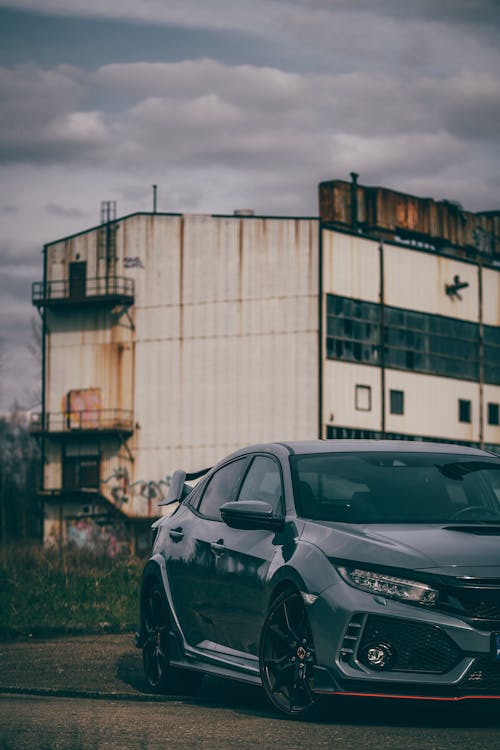 Sports Honda Civic Type R Parked in front of an Abandoned Building