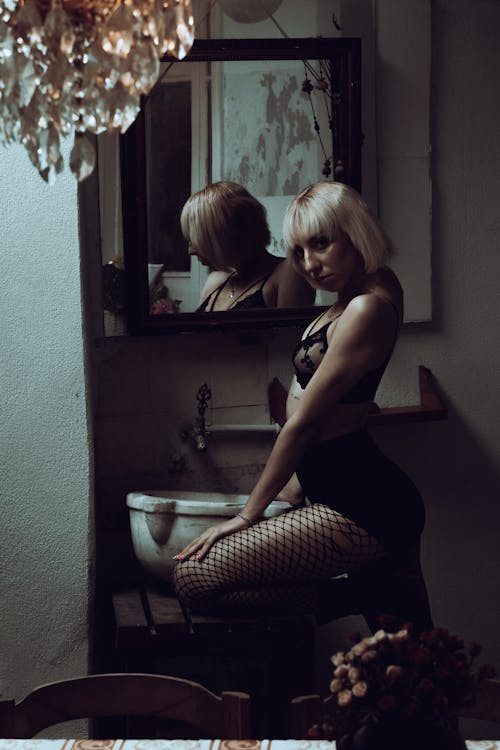 Woman in Black Lingerie Posing by Mirror