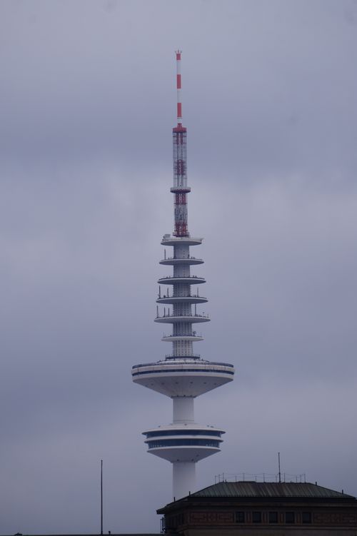 Free A close-up view of the Hamburg TV tower against a cloudy sky. Stock Photo
