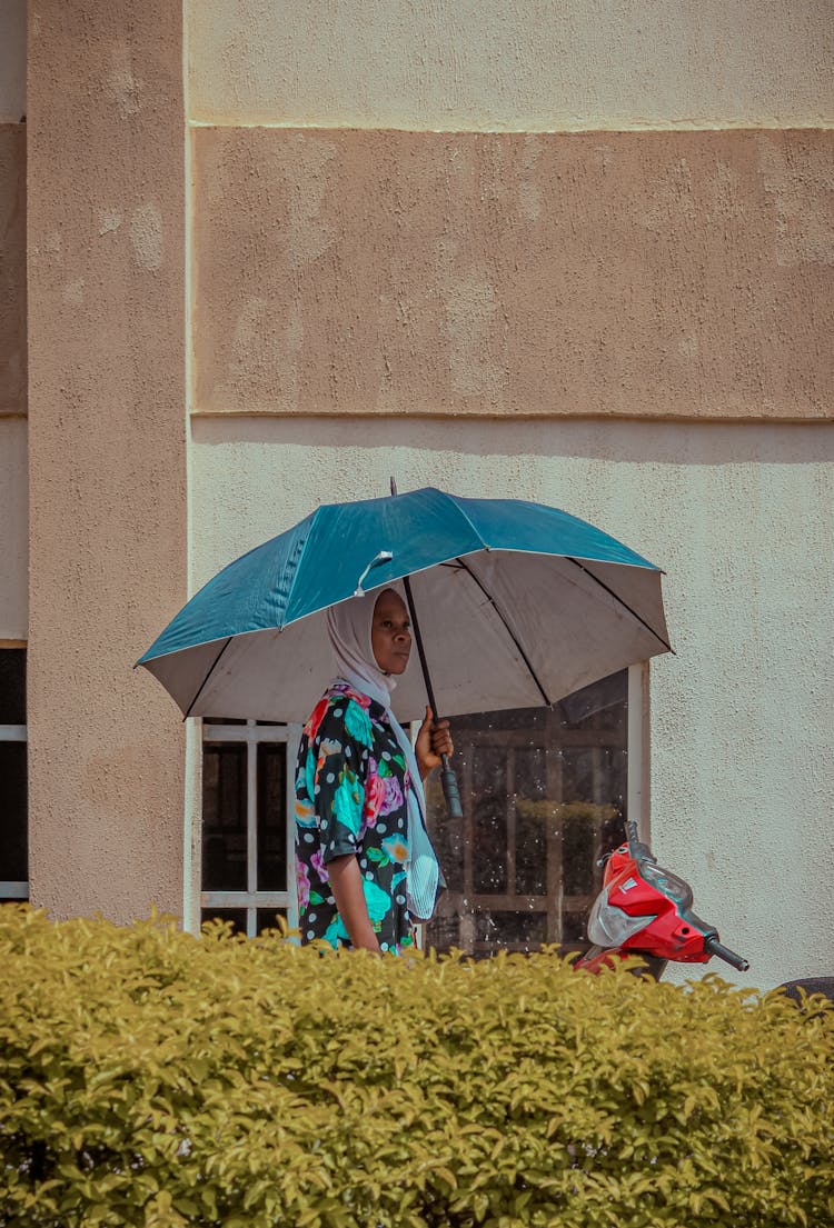 Woman Standing With Umbrella