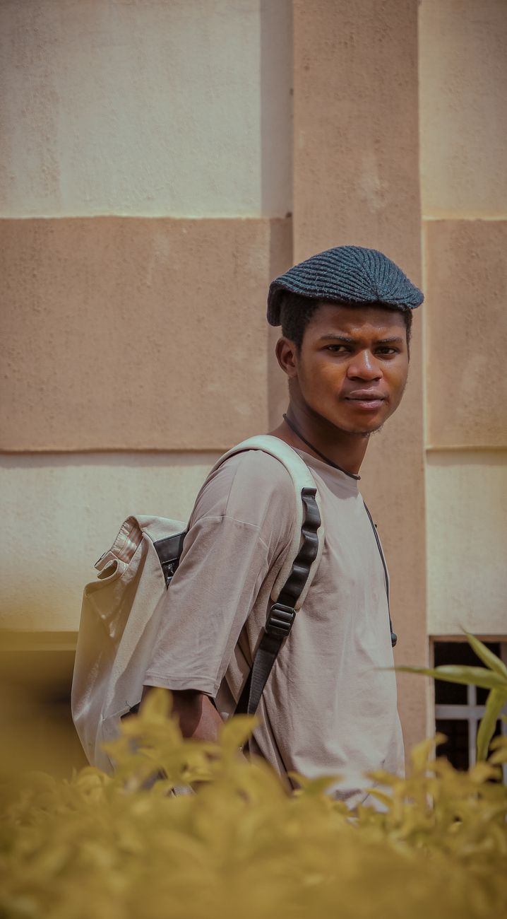 A young student walking through a university district