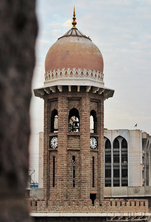 A Clock Tower with a Dome on Top 