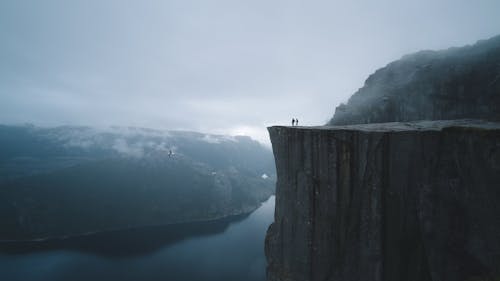 Free Two People On Mountain Cliff Stock Photo
