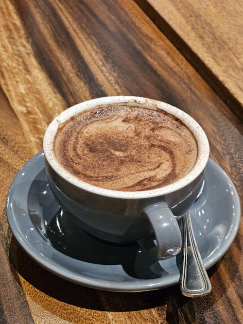 Free Blue Porcelain Cup with Coffee on a Saucer Stock Photo