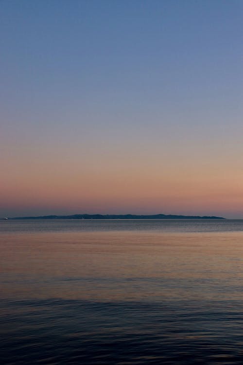 Clear Sky over Shore at Sunset
