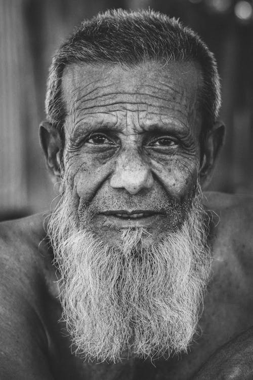 Black and White Portrait of an Elderly Man with a Long, Gray Beard 