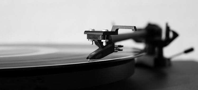 Gray Scale Photography Of Turntable