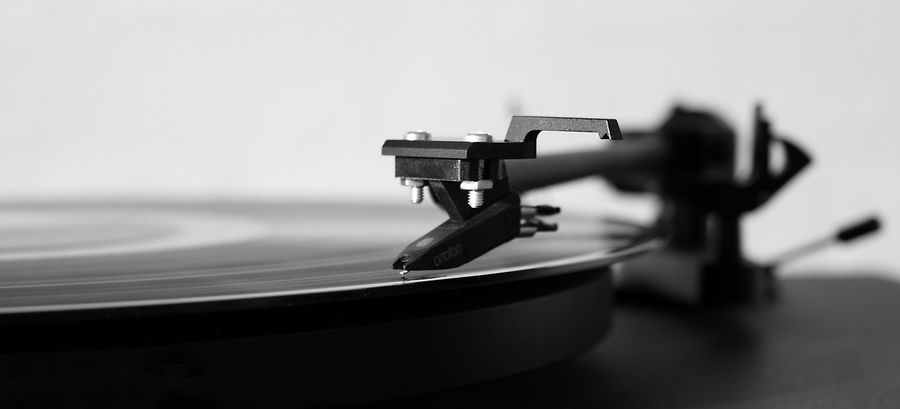 Macro of a turntable stylus on a record groove