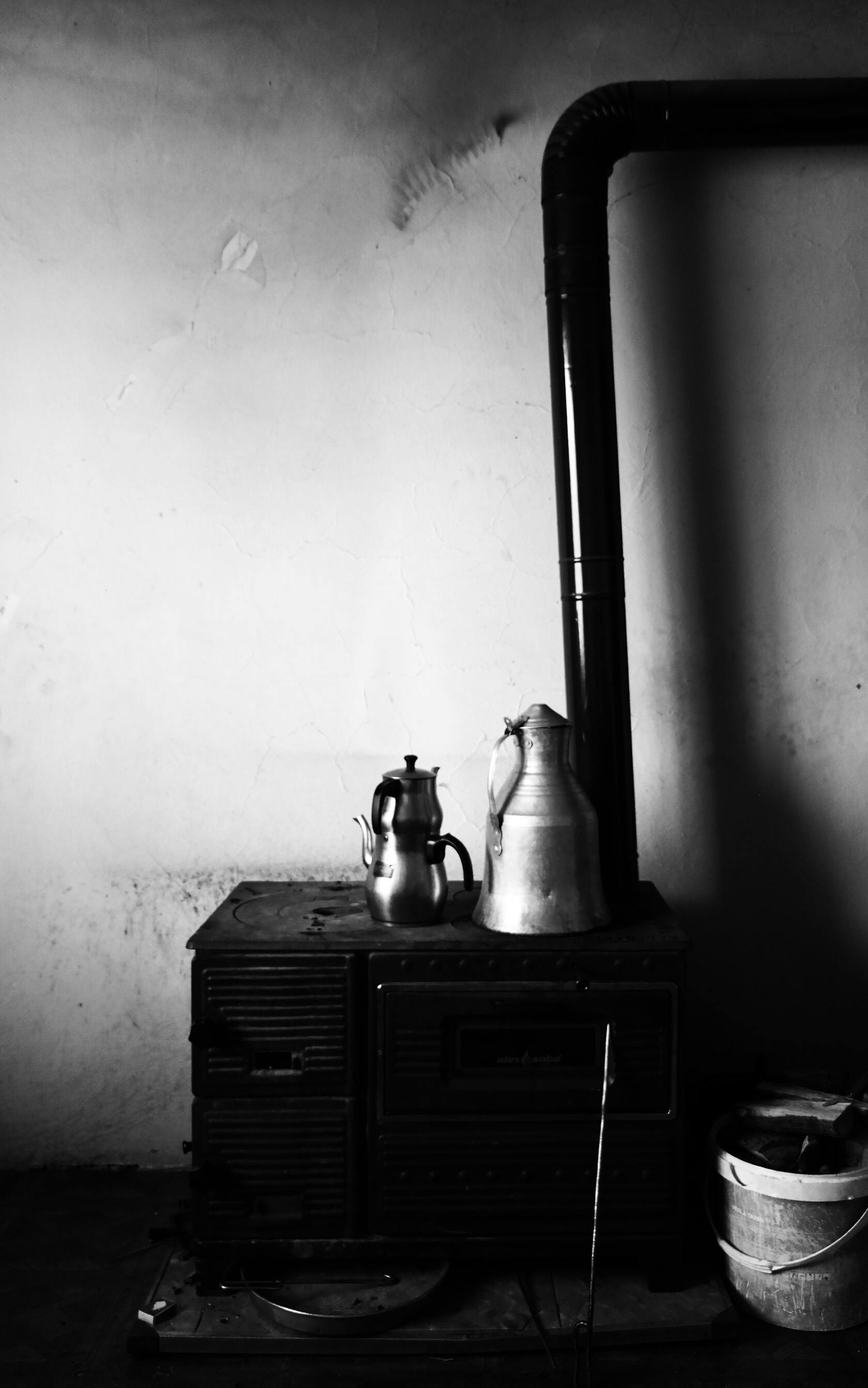 Traditional Coffee Pots on a Vintage Stove · Free Stock Photo