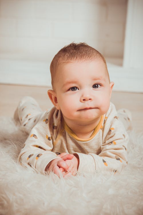 Free Photograph of a Baby Lying on Tummy Stock Photo