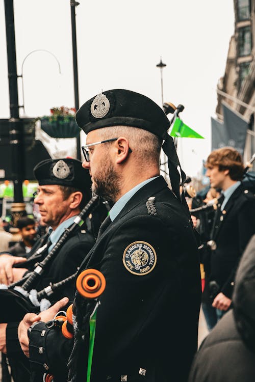 Men in Military Uniforms at a Parade in City 