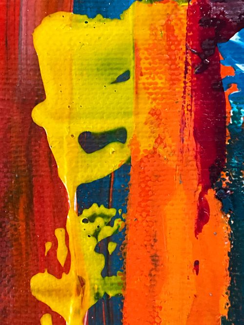 Free Dynamic abstract oil painting featuring vivid splashes of yellow, orange, and red hues. Stock Photo