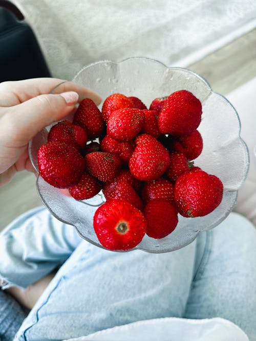 Free Woman Holding a Bowl with Strawberries  Stock Photo