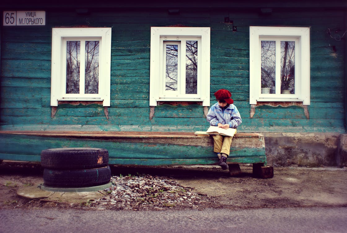 Boy Seating On Bench 