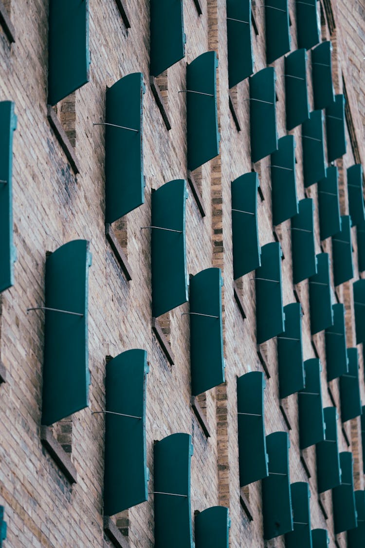 Shutters On Brick Building Windows