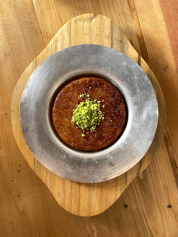 Traditional Dish In Plate On Wooden Board