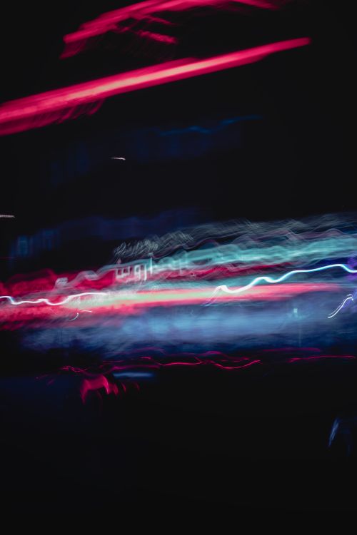 Free Vivid abstract neon light trails create a dynamic, modern visual effect against a dark backdrop. Stock Photo