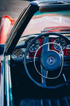 Explore the classic vintage interior of a Mercedes-Benz convertible featuring retro design elements.
