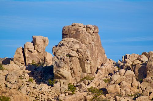 Free Stunning eroded rock formations under a clear blue sky in Joshua Tree National Park, California. Stock Photo