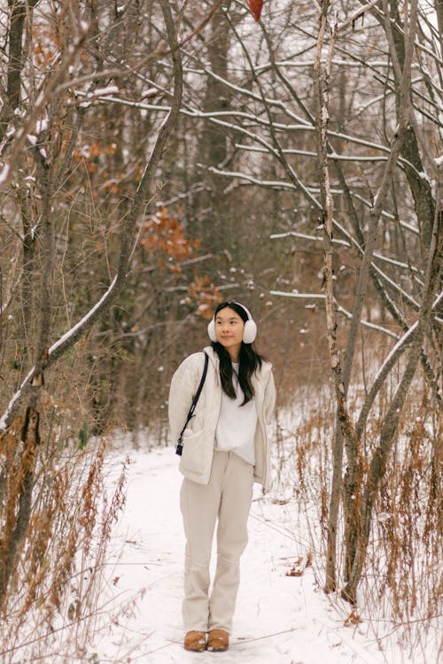 Woman Relaxing in Winter Forest