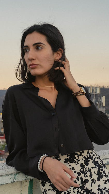 Brunette in Black Cropped Blouse