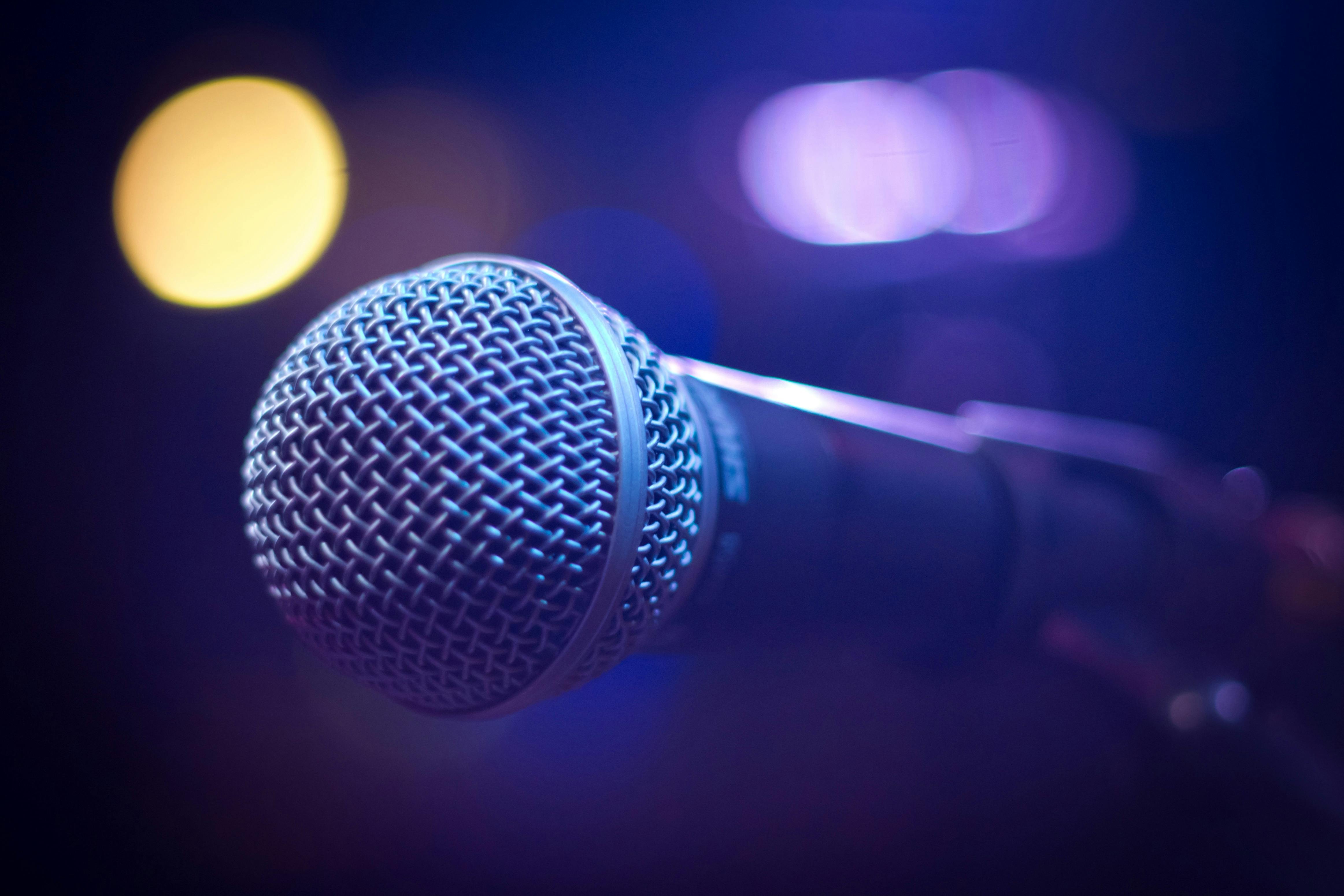 Microphone On Stage With Audience Wallpaper. Desktop Background