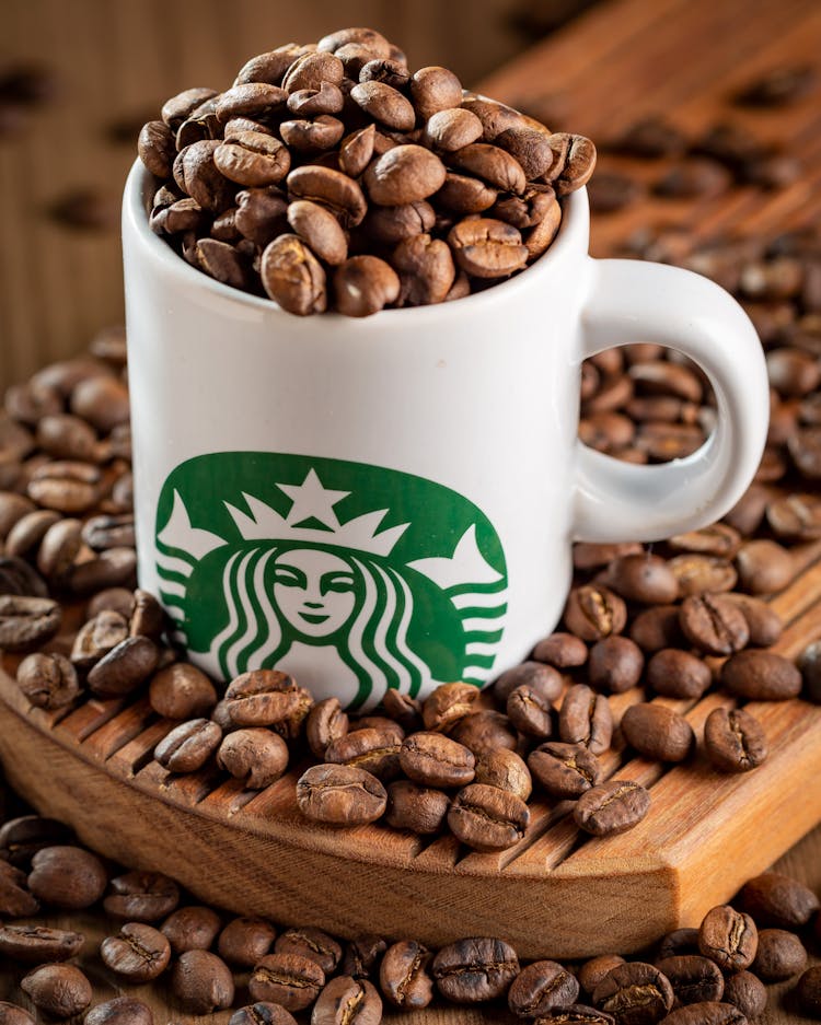 Starbucks Mug Full Of Coffee Beans