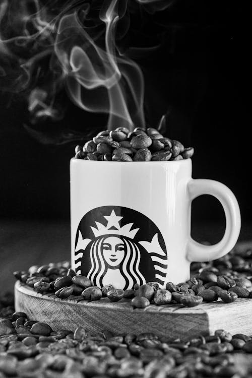 Free A Mug with Coffee Beans in Black and White Stock Photo