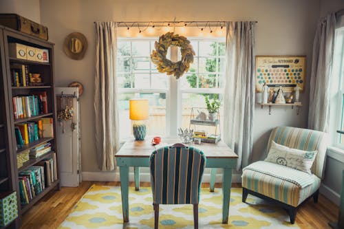 Free Beige Table Lamp on Table With Chair in Room Stock Photo