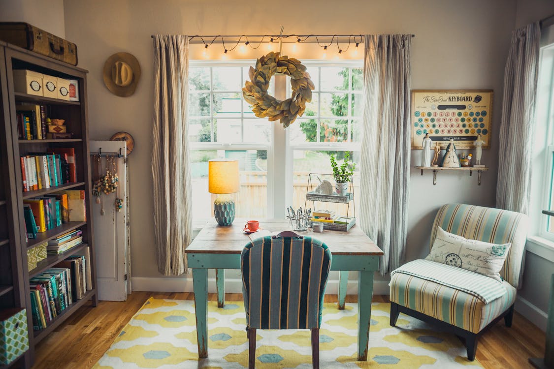 Beige Table Lamp on Table With Chair in Room