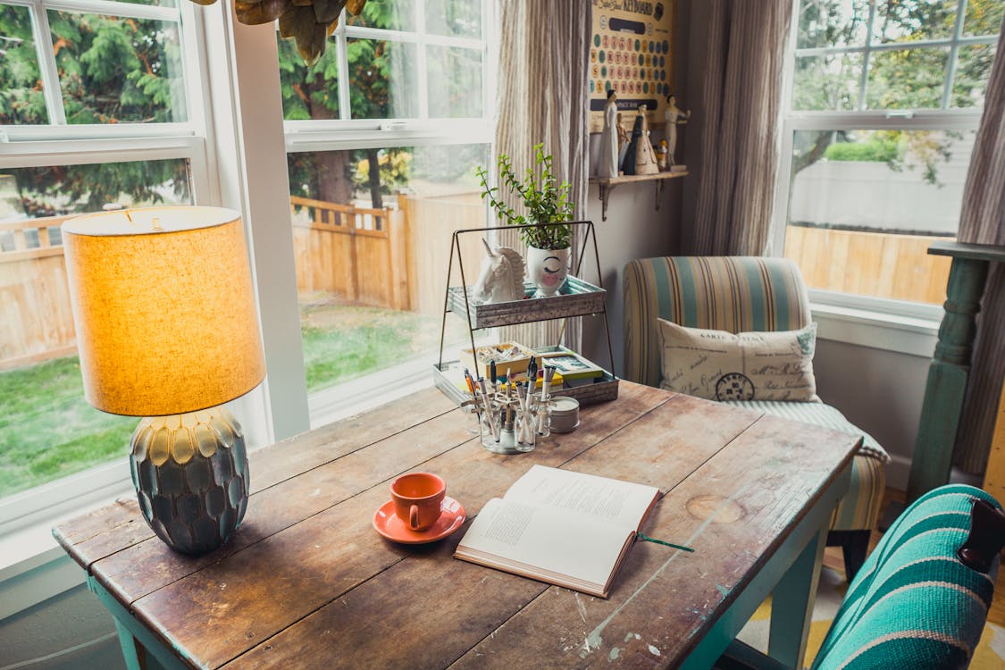 home office with book and coffee cup on desk