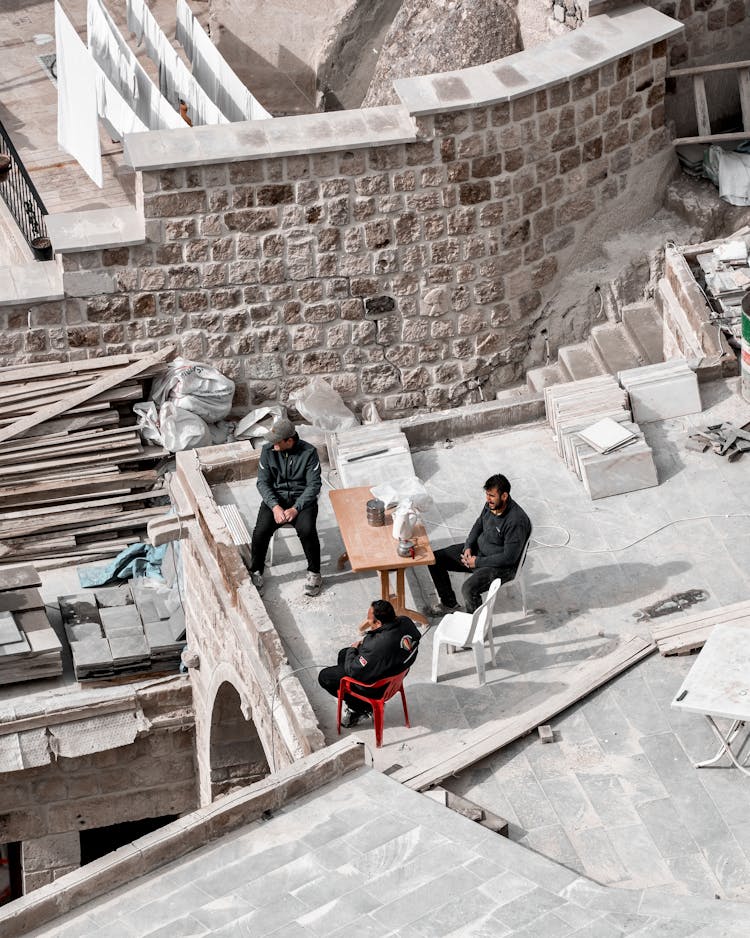 Workers At Construction Site During Lunch Break