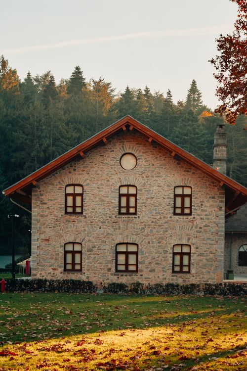 Free Beautiful stone house surrounded by trees during fall season in Istanbul, Turkey. Stock Photo
