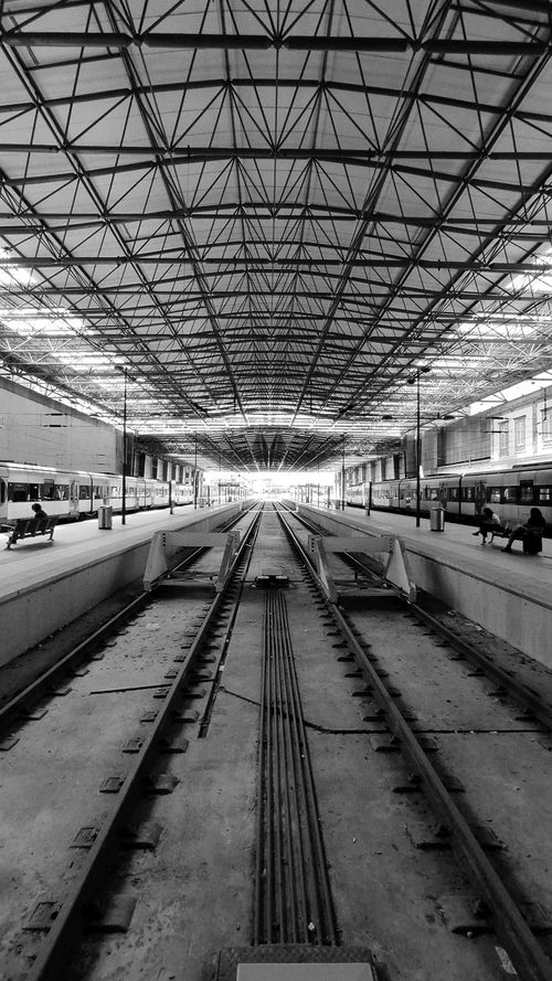 Free A striking black and white view of an urban train station in Braga, Portugal, highlighting its architectural design. Stock Photo