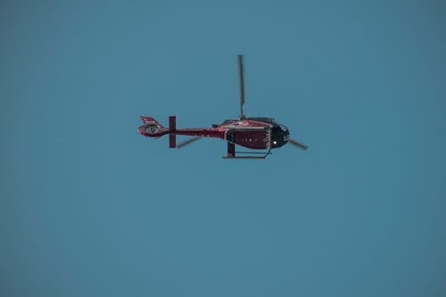 Red Helicopter in Air