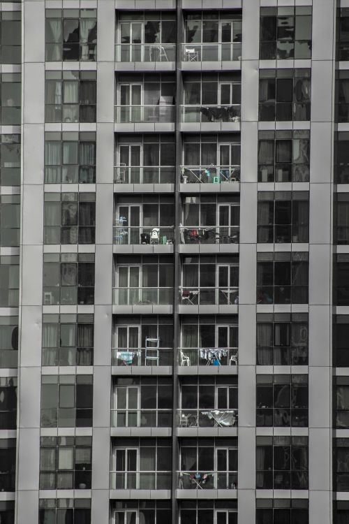Free Vertical shot of a contemporary apartment building with balconies in Dubai. Stock Photo