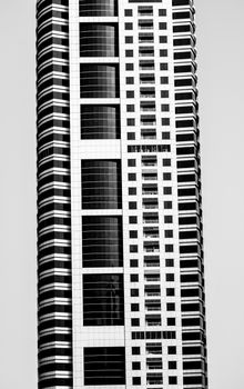 Close-up view of a modern skyscraper facade in Dubai, exhibiting sleek architecture.