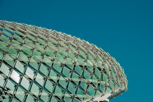 Free Detailed view of modern glass architecture in Dubai, showcasing intricate patterns and design. Stock Photo