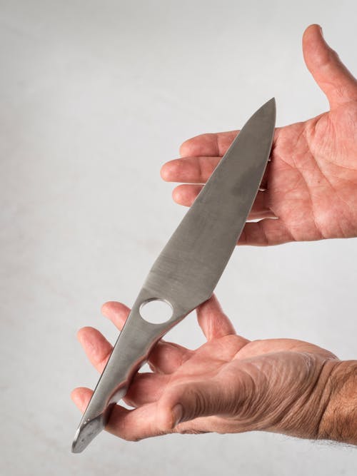 Knife Blade on Hands