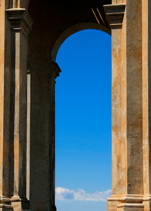 View of the Blue Sky through an Archway 