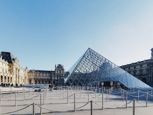The Louvre Pyramid and Louvre Museum in Paris, France 