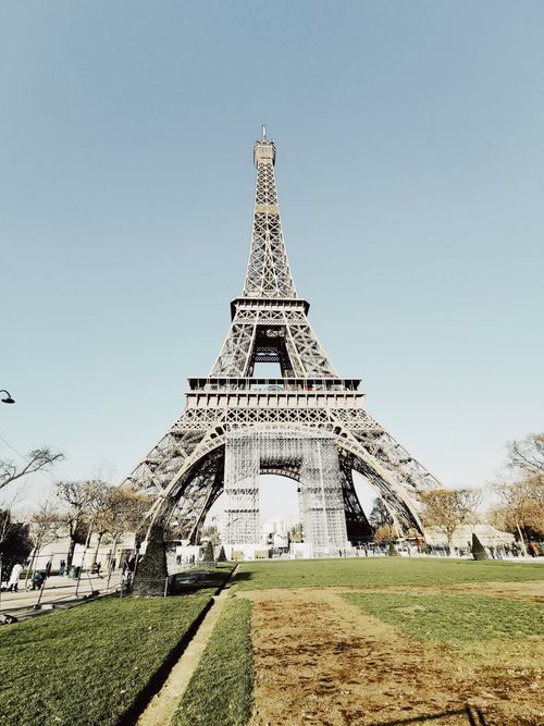 Free Capturing the iconic Eiffel Tower in Paris under a clear sky, showcasing its architectural beauty. Stock Photo