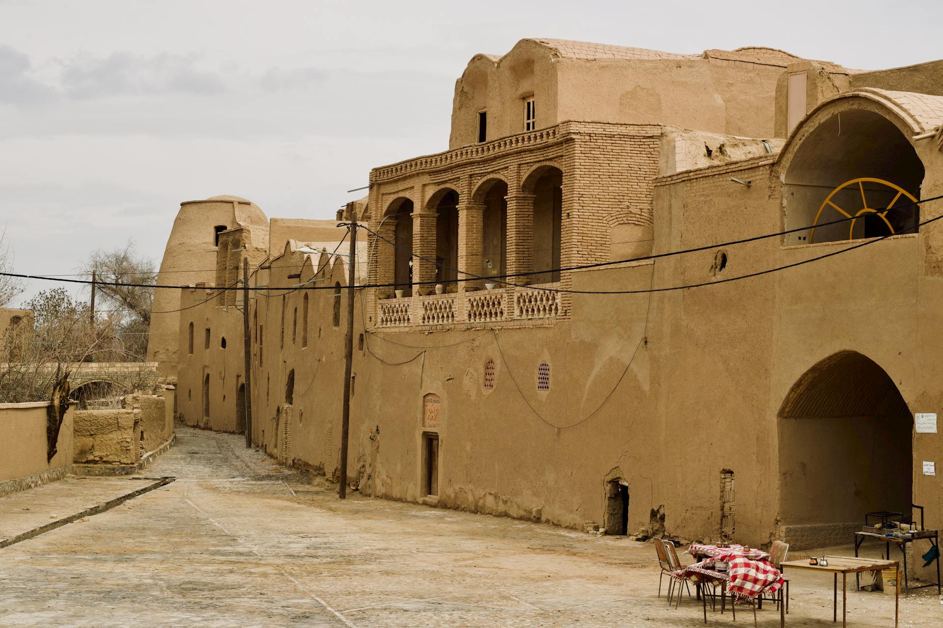 Explore the ancient architecture of Kharanaq village in Yazd Province, Iran, showcasing its traditional mud-brick buildings.