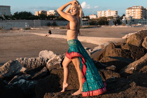 Free Woman in Brown Bra and Teal Skirt Stock Photo