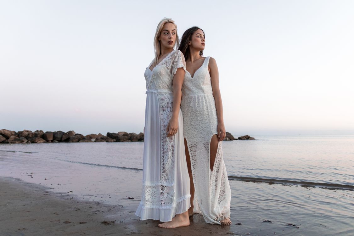 Two Women Wearing White Lace Dress At The Beach Free Stock Photo Two Women Wearing White Lace Dress At The Beach Free Stock Photo