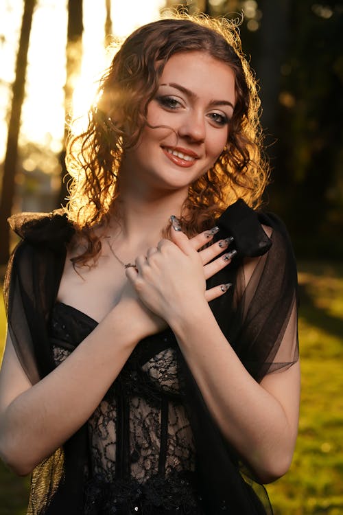 Portrait of Smiling Woman in Black Gown