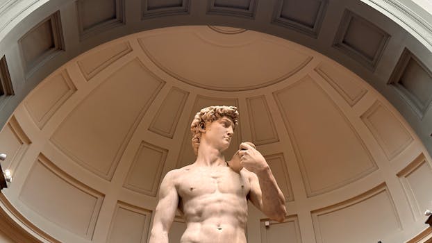 Low angle view of Michelangelo's David sculpture in Florence museum dome.