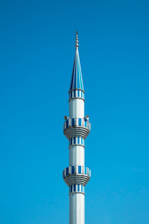 A Minaret on the Background of a Clear Blue Sky 