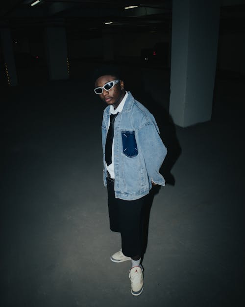 Teenage Boy with Sunglasses Posing at Night